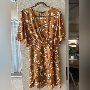 Wrap front dress size medium. Worn once. Rust color.